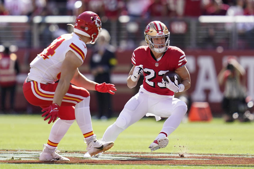 San Francisco 49ers running back Christian McCaffrey, right, runs against Kansas City Chiefs linebacker Leo Chenal during the first half of an NFL football game in Santa Clara, Calif., Sunday, Oct. 23, 2022. (AP Photo/Godofredo A. Vásquez)