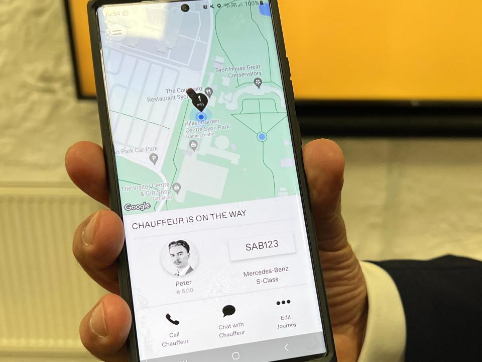 The Wheely App is displayed on a phone, showing Insider's Pete Syme as the chauffeur