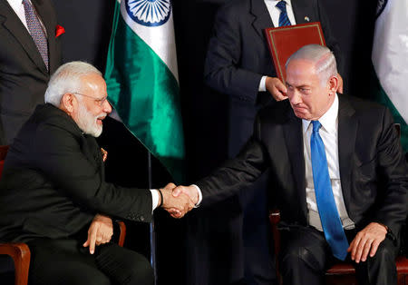 Indian Prime Minister Narendra Modi shakes hands with Israeli Prime Minister Benjamin Netanyahu as they deliver joint statements during an exchange of co-operation agreements ceremony in Jerusalem July 5, 2017. REUTERS/Amir Cohen