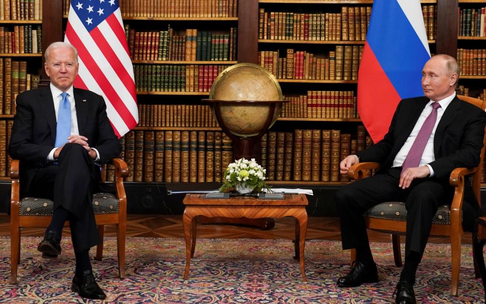 Putin and Biden sitting down - REUTERS/Kevin Lamarque