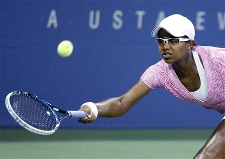 Victoria Duval of the U.S. reaches for a forehand during her loss to Daniela Hantuchova of Slovakia at the U.S. Open tennis championships in New York, August 29, 2013. REUTERS/Eduardo Munoz