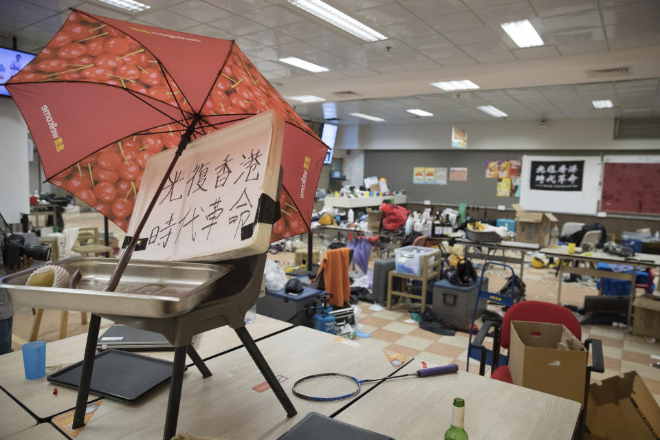 In this Friday, Nov. 22, 2019, photo, belongings of anti-government protesters are left inside cafeteria at the Hong Kong Polytechnic University campus in Hong Kong. Most of the protesters who took over the university have left following clashes with police, but an unknown number have remained inside, hoping somehow to avoid arrest. (AP Photo/Vincent Thian)