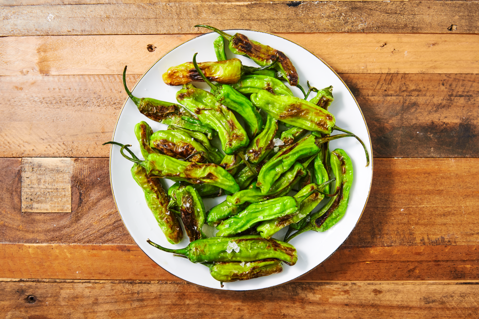 <p>Blistered shishito peppers make the perfect snack. Healthy and easy, they aren't very spicy, which means you can mindlessly eat them without burning your face off. They take almost no time to make, but they are still good enough to make for dinner guests. Cook them in a cast-iron to really get the deep blisters you're looking for.</p><p>Get the <strong><a href="https://www.delish.com/cooking/recipe-ideas/a26988541/shishito-peppers-recipe/" rel="nofollow noopener" target="_blank" data-ylk="slk:Shishito Peppers recipe;elm:context_link;itc:0;sec:content-canvas" class="link ">Shishito Peppers recipe</a></strong>. </p>