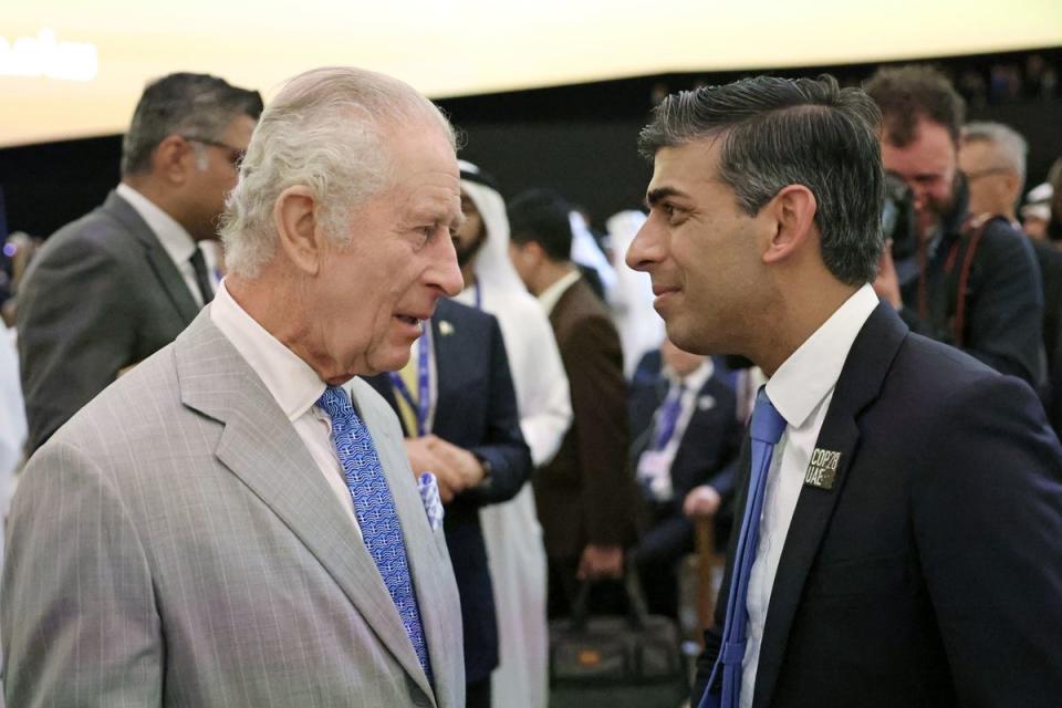 Rishi Sunak speaks to the King at Cop28 in Dubai (PA)