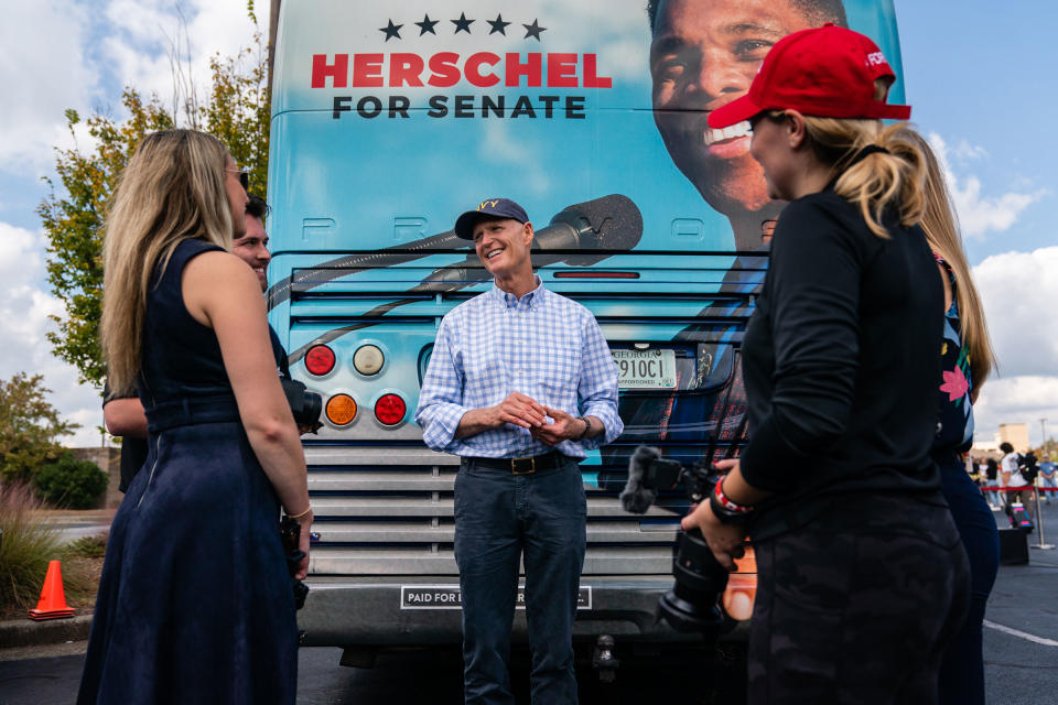 Scott speaks with campaign staff at a Herschel Walker campaign event in Carrollton, Ga., on Oct. 11, 2022.<span class="copyright">Elijah Nouvelage—Getty Images</span>