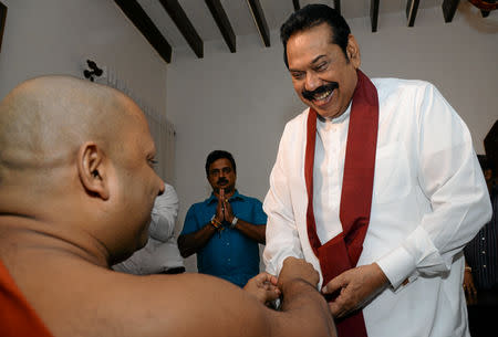 Sri Lanka's former leader Mahinda Rajapaksa attends a religious ceremony after he resigned from the prime minister post in Colombo, Sri Lanka December 15, 2018. REUTERS/Stringer