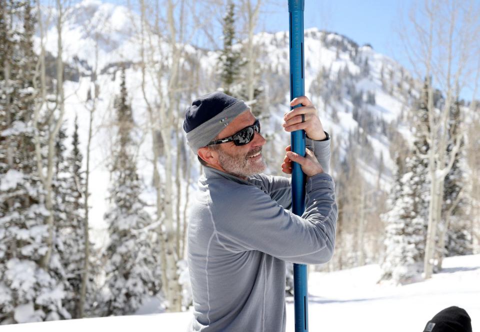 Troy Brosten, Natural Resources Conservation Service snow survey hydrologist, tries to drive a federal snow tube deeper into the snowpack to measure the current snowpack at the Atwater SNOwpack TELemetry (SNOTEL) site, operated by the USDA’s NRCS, in Alta, on Thursday.
