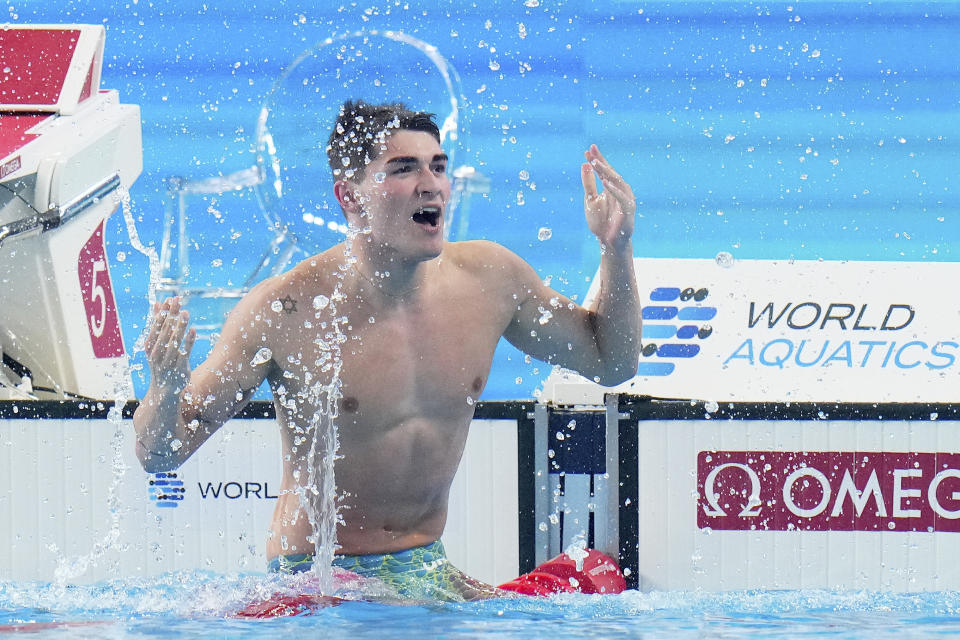 Diogo Matos Ribeiro of Portugal celebrates after winning the men's 100 meters butterfly final at the World Aquatics Championships in Doha, Qatar, Saturday, Feb. 17, 2024. (AP Photo/Hassan Ammar)