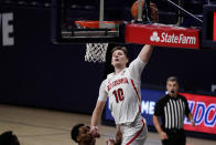 Arizona forward Azuolas Tubelis (10) dunks over Arizona State guard Alonzo Verge Jr. during the first half of an NCAA college basketball game, Monday, Jan. 25, 2021, in Tucson, Ariz. (AP Photo/Rick Scuteri)