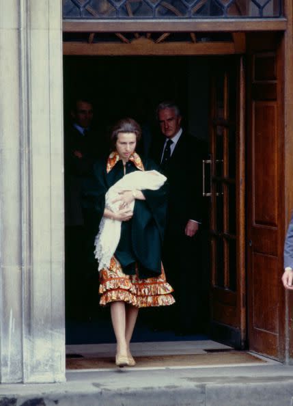 <p>Princess Anne leaves the hospital carrying <a href="https://www.townandcountrymag.com/society/tradition/a20150347/zara-tindall-facts/" rel="nofollow noopener" target="_blank" data-ylk="slk:her newborn baby girl, Zara;elm:context_link;itc:0;sec:content-canvas" class="link ">her newborn baby girl, Zara</a>.</p>