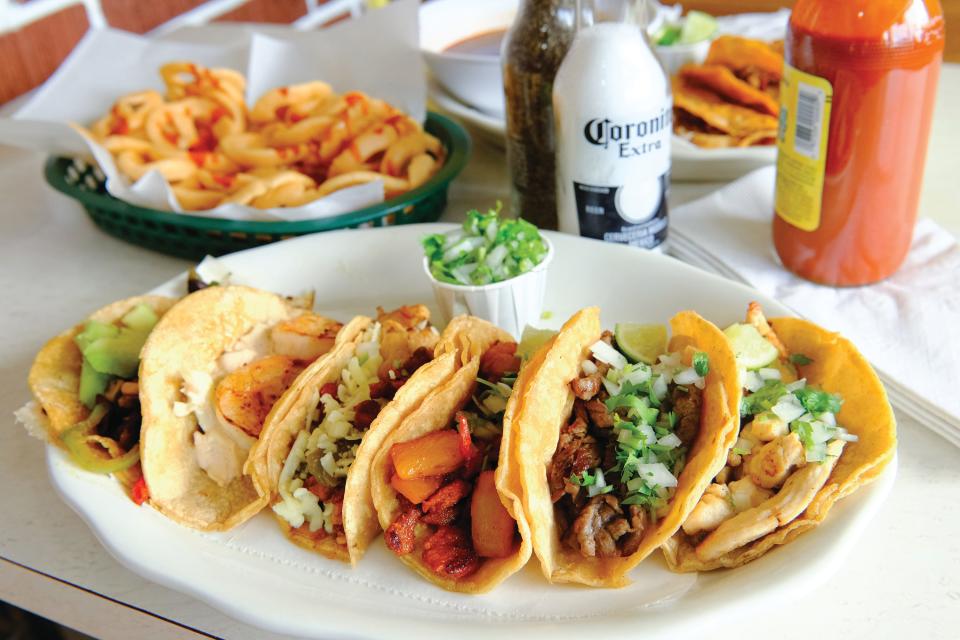 An assortment of tacos, chicharrones, and quesabirria from Four Tacos Locos in Greenville. 