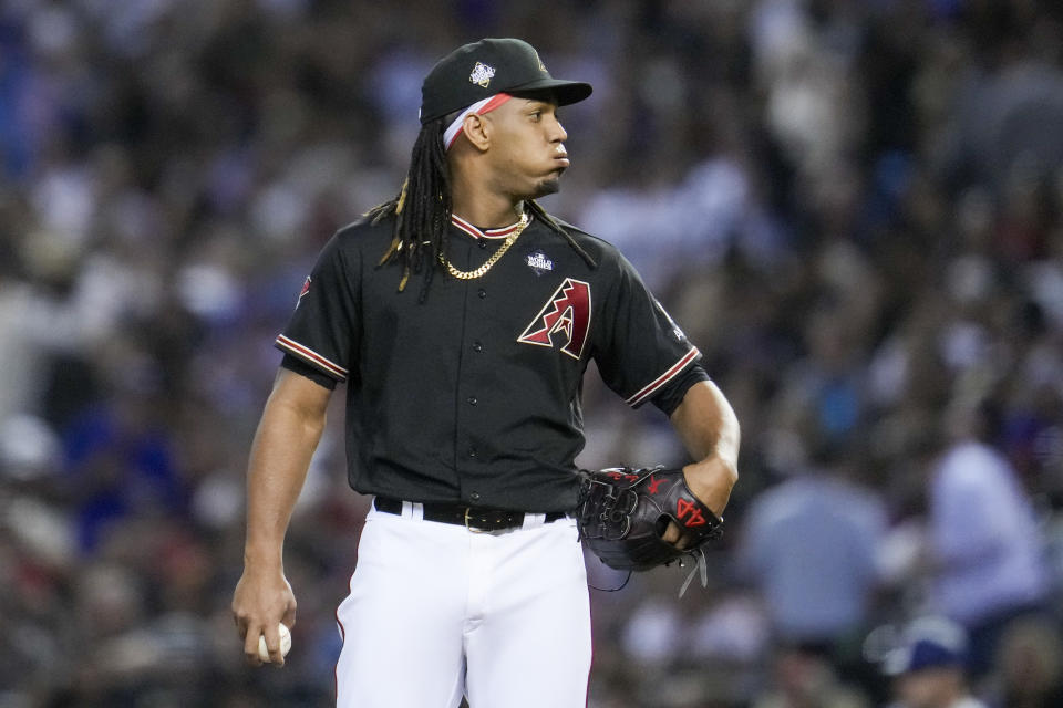 Arizona Diamondbacks relief pitcher Luis Frias reacts during the third inning in Game 4 of the baseball World Series against the Texas Rangers Tuesday, Oct. 31, 2023, in Phoenix. (AP Photo/Godofredo A. Vásquez)
