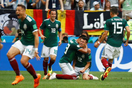 Soccer Football - World Cup - Group F - Germany vs Mexico - Luzhniki Stadium, Moscow, Russia - June 17, 2018 Mexico's Hirving Lozano celebrates with Jesus Gallardo after scoring their first goal REUTERS/Kai Pfaffenbach