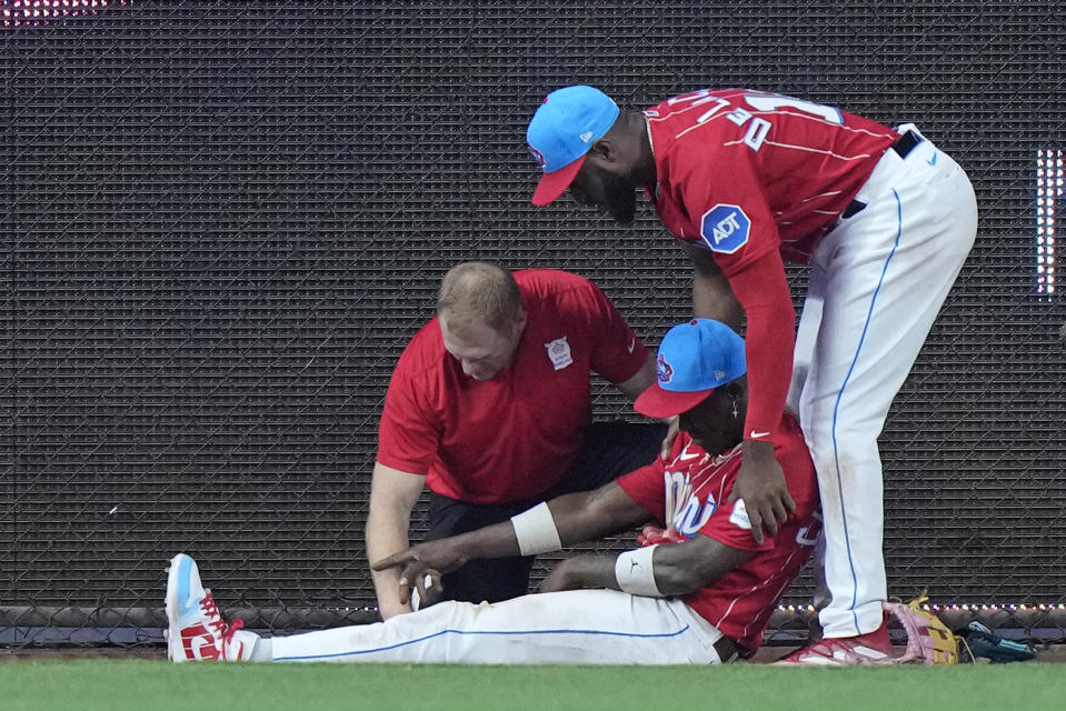 Jazz Chisholm injured his toe running into the outfield wall. (AP Photo/Wilfredo Lee)