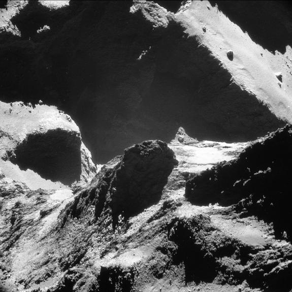 This single-frame Rosetta navigation camera image of Comet 67P/Churyumov-Gerasimenko was taken on October 19, 2014, at a distance of approximately 4.9 miles (7.9 km) from the comet's surface and released on May 28. The image looks across the ne