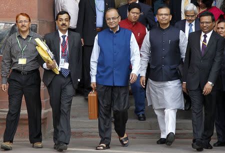 India's Finance Minister Arun Jaitley (C) leaves his office to present the 2015/16 federal budget in New Delhi February 28, 2015. REUTERS/Vijay Mathur