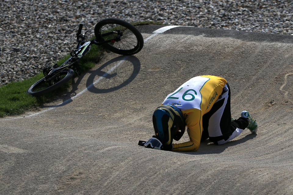 LONDON, ENGLAND - AUGUST 09: Khalen Young of Australia lies on the ground after crashing during the Men's BMX Cycling Quarter Finals on Day 13 of the London 2012 Olympic Games at BMX Track on August 9, 2012 in London, England. (Photo by Phil Walter/Getty Images)