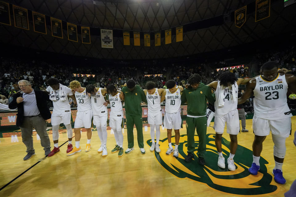 Baylor players gather for a prayer at the end of an NCAA college basketball game against Mississippi Valley State, Friday, Dec. 22, 2023, in Waco, Texas. Baylor won 107-48 during the final basketball game at the Ferrell Center. Baylor will move on to its new facility, the Foster Pavilion, in January. (AP Photo/Julio Cortez)