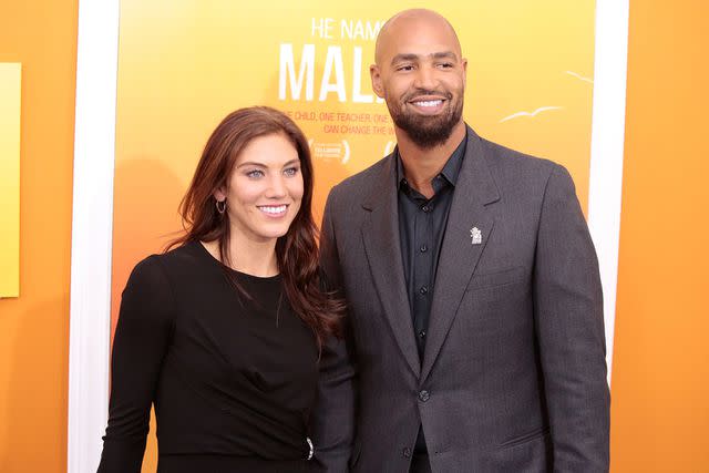 <p>Taylor Hill/FilmMagic</p> Hope Solo and Jerramy Stevens in 2015