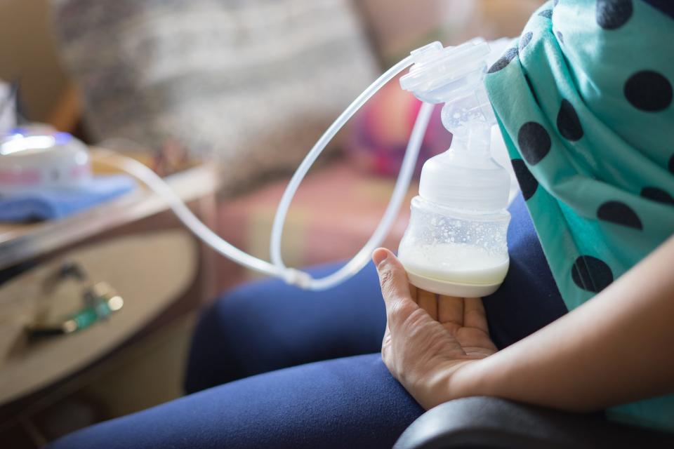 Mother pumping breast milk.