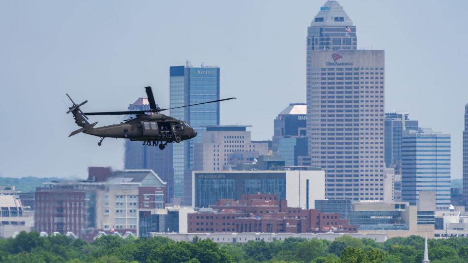 Soldiers from the U.S. Army Parachute Team take off in a UH-60 Blackhawk helicopter ahead of a parachute jump at the Indianapolis Motor Speedway for the Indianapolis 500 events in Speedway, Indiana on May 27. (Megan Hackett/Army)