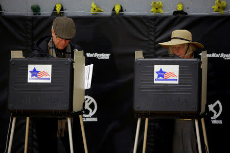 Voters fills out their ballot at a polling place during a runoff election for mayoral candidates Toni Preckwinkle and Lori Lightfoot in Chicago, Illinois, U.S., April 2, 2019. REUTERS/Joshua Lott