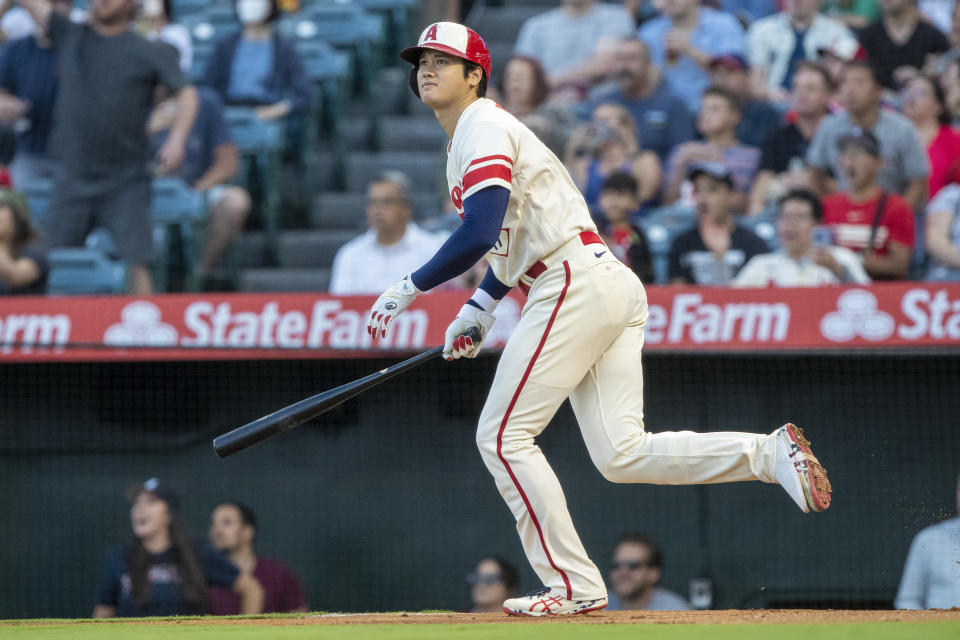 Los Angeles Angels' Shohei Ohtani watches his RBI double against the Seattle Mariners during the first inning of a baseball game in Anaheim, Calif., Saturday, Sept. 17, 2022. (AP Photo/Alex Gallardo)