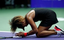 Tennis - WTA Tour Finals - Singapore Indoor Stadium, Kallang, Singapore - October 22, 2018 Japan's Naomi Osaka reacts during her group stage match against Sloane Stephens of the U.S. REUTERS/Edgar Su