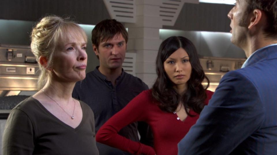 Gemma Chan standing with three other people in Doctor Who.