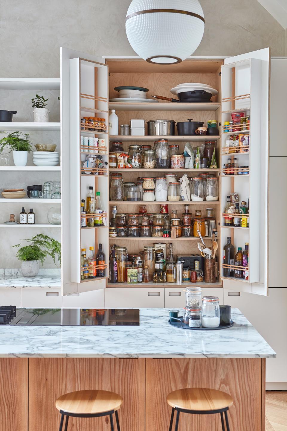 "Due to her profession, Anna has a serious amount of cookware and needs her selection of ingredients to be easily accessible," says George. "For the latter, we tailored an extra tall larder [pantry, for those not familiar with the British term], and Anna specified the individual height of the internal shelves, as she had plotted what she wanted to go where."