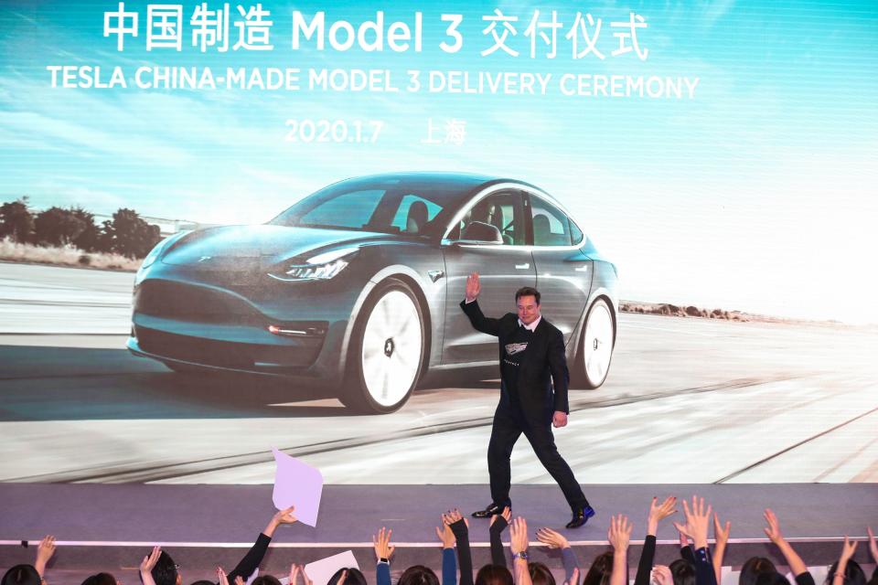 Tesla CEO Elon Musk gestures during the Tesla China-made Model 3 Delivery Ceremony in Shanghai on January 7, 2020 i