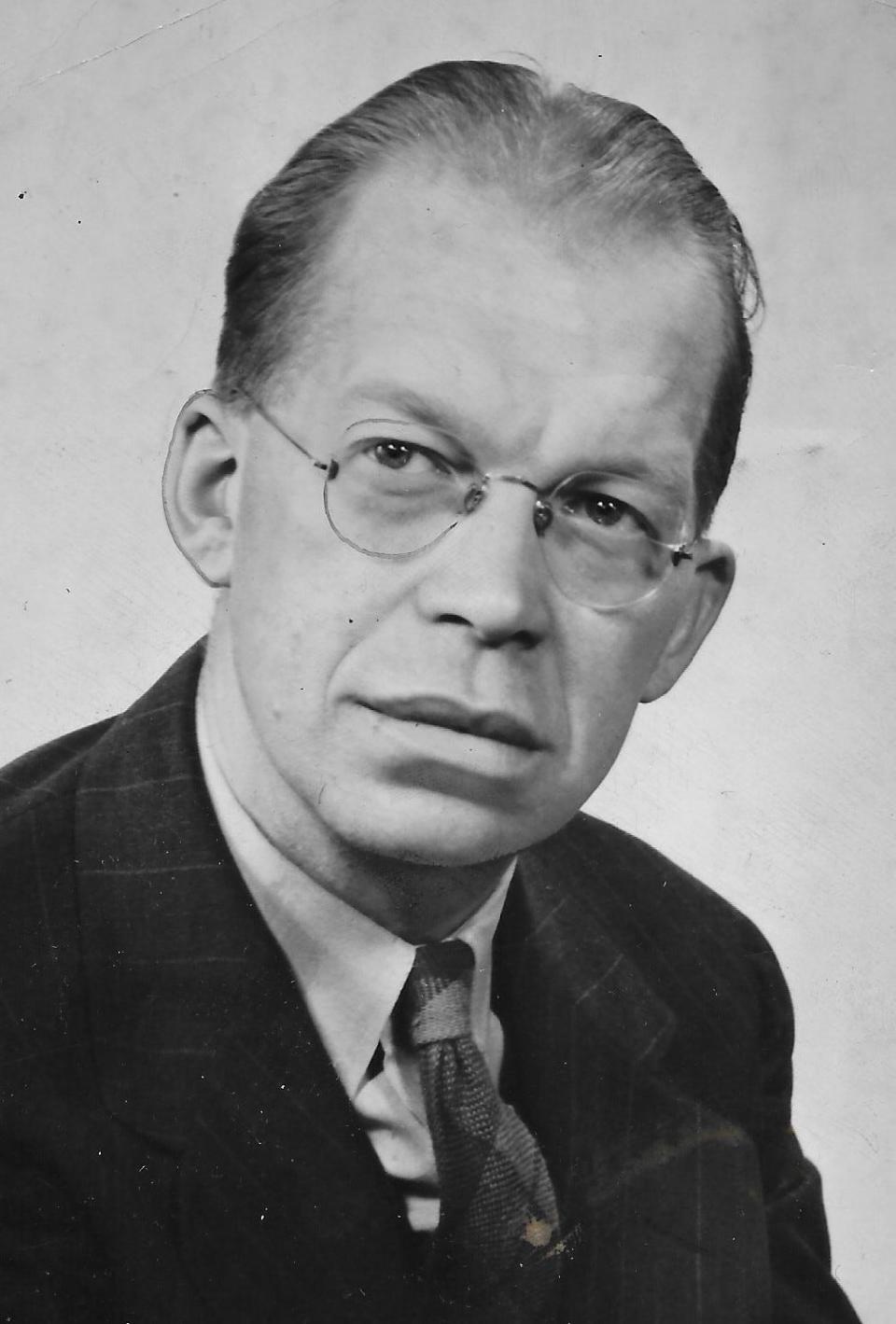 James S. Jackson, associate editor of the Akron Beacon Journal, sits for a studio portrait in 1944.