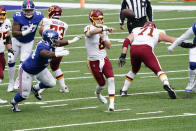 Washington Football Team's Kyle Allen (8) throws a pass away from New York Giants' Dalvin Tomlinson (94) during the first half of an NFL football game Sunday, Oct. 18, 2020, in East Rutherford, N.J. (AP Photo/Bill Kostroun)