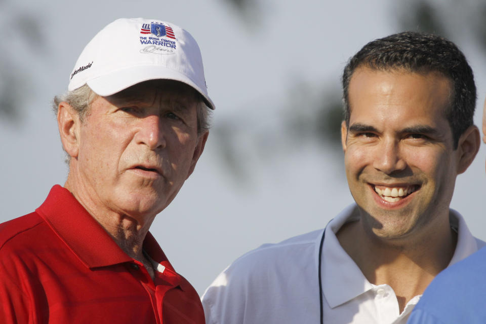 FILE - In this Monday, Sept. 24, 2012, file photo George P. Bush, right, stands with his uncle former President George W. Bush, left, during the Bush Center Warrior Open in Irving, Texas. George P. Bush, son of one-time Florida Gov. Jeb Bush, has made a campaign filing in Texas that is required of candidates planning to run for state office, an official said Thursday, Nov 8, 2012. (AP Photo/LM Otero, File)