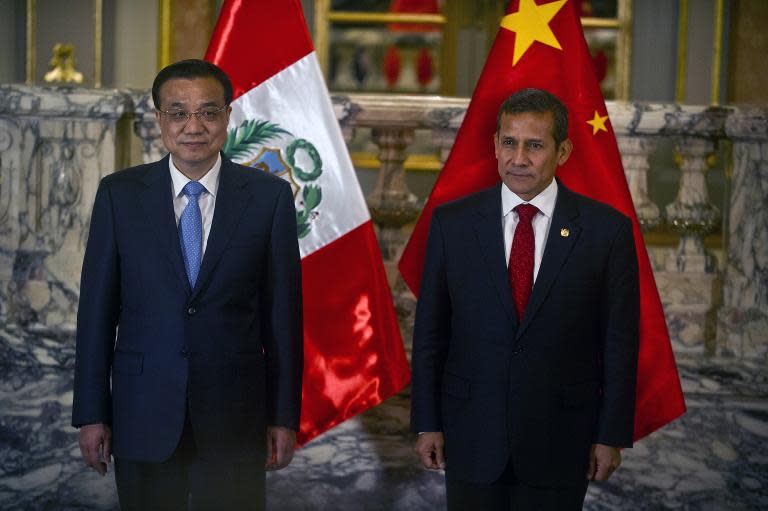 China's Prime Minister Li Keqiang (L) and Peruvian President Ollanta Humala pictured during a ceremony at the presidential palace in Lima on May 22, 2015. Li is on a two-day official visit to Peru, after visiting Brazil and Colombia