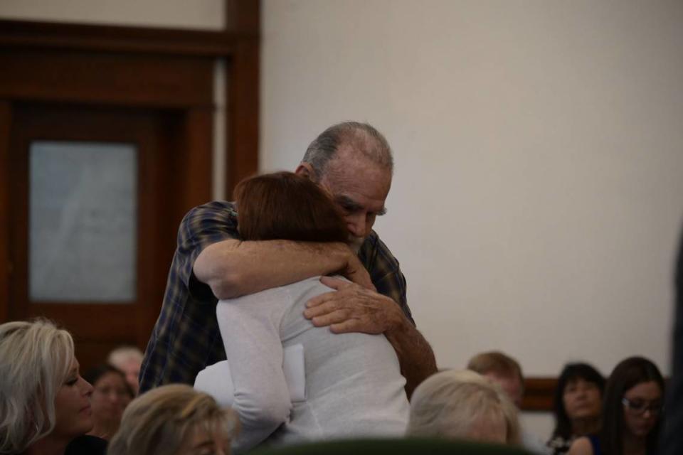 Larry and Kay Woodcock embrace during Lori Vallow Daybell’s sentencing hearing.