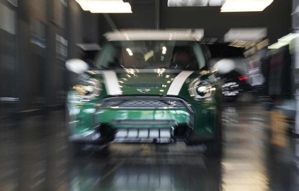 An unsold 2024 Cooper S hardtop sits in a Mini dealership Friday, July 21, 2023, in Highlands Ranch, Colo. Car insurance and repair costs have been rising sharply because new and used car prices soared amid shortages of chips and parts in the aftermath of the pandemic. (AP Photo/David Zalubowski)