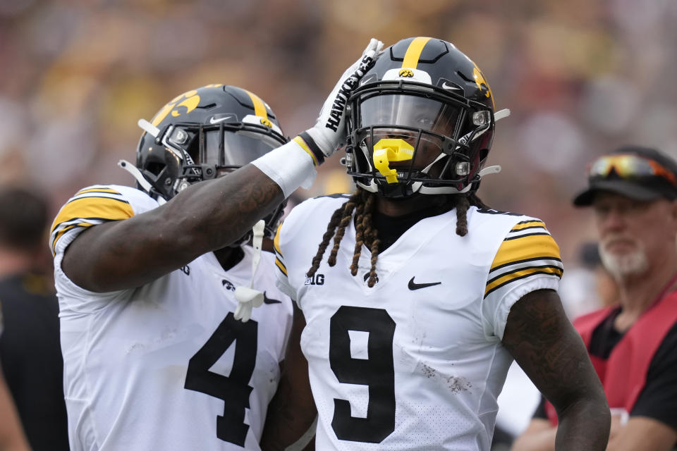 Iowa running back Jaziun Patterson (9) celebrates with teammate Leshon Williams (4) after scoring a touchdown during the first half of an NCAA college football game against Iowa State, Saturday, Sept. 9, 2023, in Ames, Iowa. (AP Photo/Charlie Neibergall)