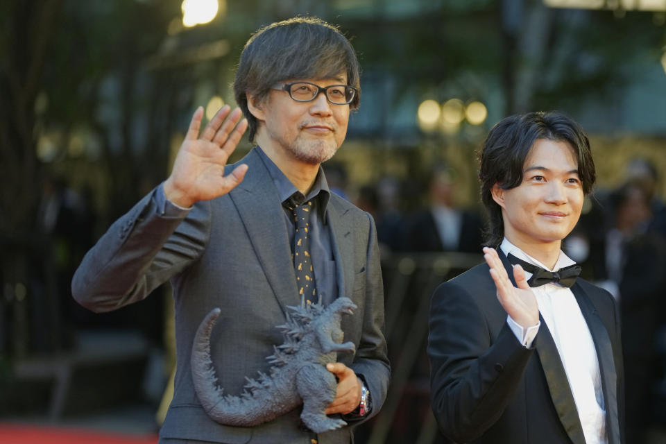 Director of Godzilla Minus One, Takashi Yamazaki, left, actor Ryunosuke Kamiki pose for a photo on the red carpet, ahead of the opening ceremony of the 36th Tokyo International Film Festival (TIFF) in Tokyo, Japan, Monday, Oct. 23, 2023. (AP Photo/Shuji Kajiyama)