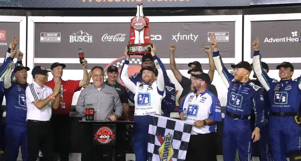 Chris Buescher and the crew celebrate in Victory Lane, Saturday August 26, 2023 after winning the Coke Zero Sugar 400 at Daytona International Speedway.