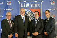 FILE - in this Wednesday, May 22, 2019, file photo, John Davidson, the new president of the New York Rangers, second from left, poses for a picture with adviser to the owner, Glen Sather, left, general manager Jeff Gorton, second from right, and coach David Quinn during a news conference in New York. The New York Rangers abruptly fired president John Davidson and general manager Jeff Gorton on Wednesday, May 5, 2021 with three games left in the season. Chris Drury was named president and GM. He previously served as associate GM under Davidson and Gorton. (AP Photo/Seth Wenig)