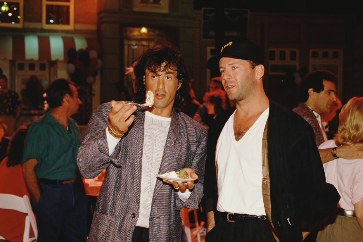 American actor, director, screenwriter and producer Sylvester Stallone (L) and actor Bruce Willis attend Demi Moore's 30th birthday party at Six Flags Magic Mountain amusement park in Valencia. (Photo by Bill Nation/Sygma via Getty Images)