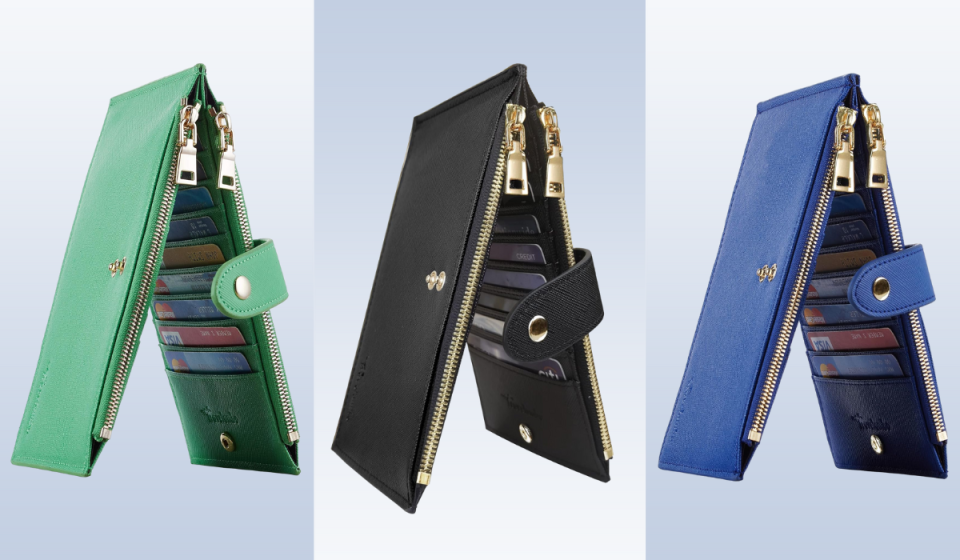 three travel wallets in green, black and blue