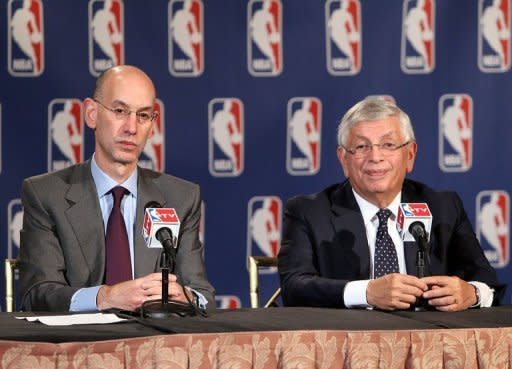 Adam Silver (L), Deputy Commissioner of the NBA, speaks to the media following the NBA Board of Governors meeting, during which Commissioner David Stern (R) outlined his plans to step down in February 2014 and nominate Silver as his successor, at the St. Regis hotel in New York City on October 25