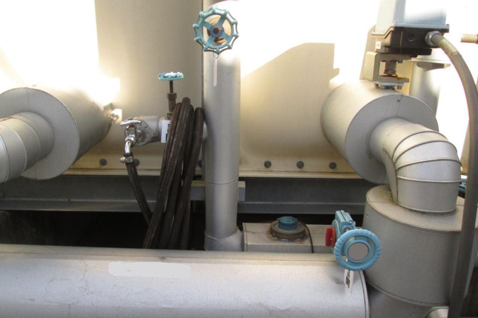 A close up of a whole house reverse osmosis system.