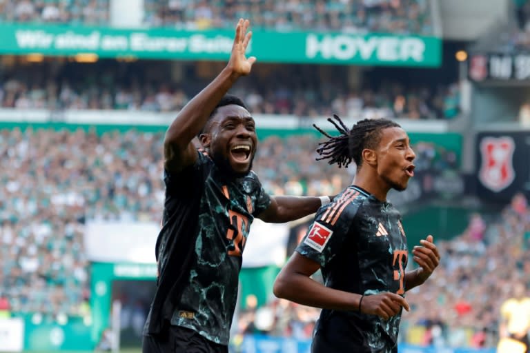 Michael Olise (R) scored two goals and set up two more in Bayern Munich's 5-0 win at Werder Bremen (AXEL HEIMKEN)