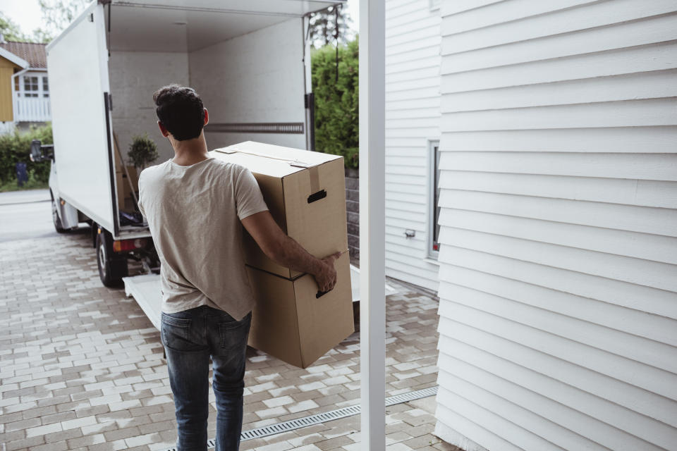 A man loading a moving truck