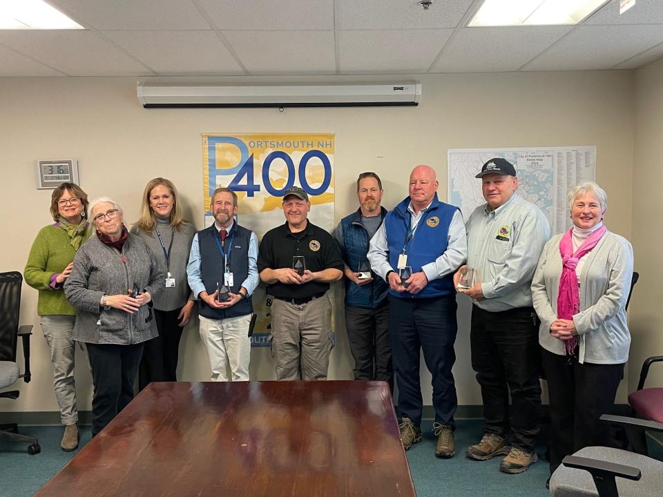 The DPW team gathered for the PNH400 “Endeavor” gift presentation (left to right): PNH400 Legacy Committee chair Ernie Greenslade, City Public Information Officer Stephanie Seacord, City Manager Karen Conard, DPW Director Peter Rice, Construction Project Manager Dave Desfosses, Parks & Greeneries Foreman Corin Hallowell, General Foreman Jim Dumont, General Foreman Jim Tow, PNH400 Managing Director Valerie Rochon.