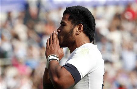 England's Manusamoa Tuilagi celebrates after scoring during the match against Italy in their Six Nations rugby union match at Olympic Stadium in Rome, March 15, 2014. REUTERS/Alessandro Bianchi