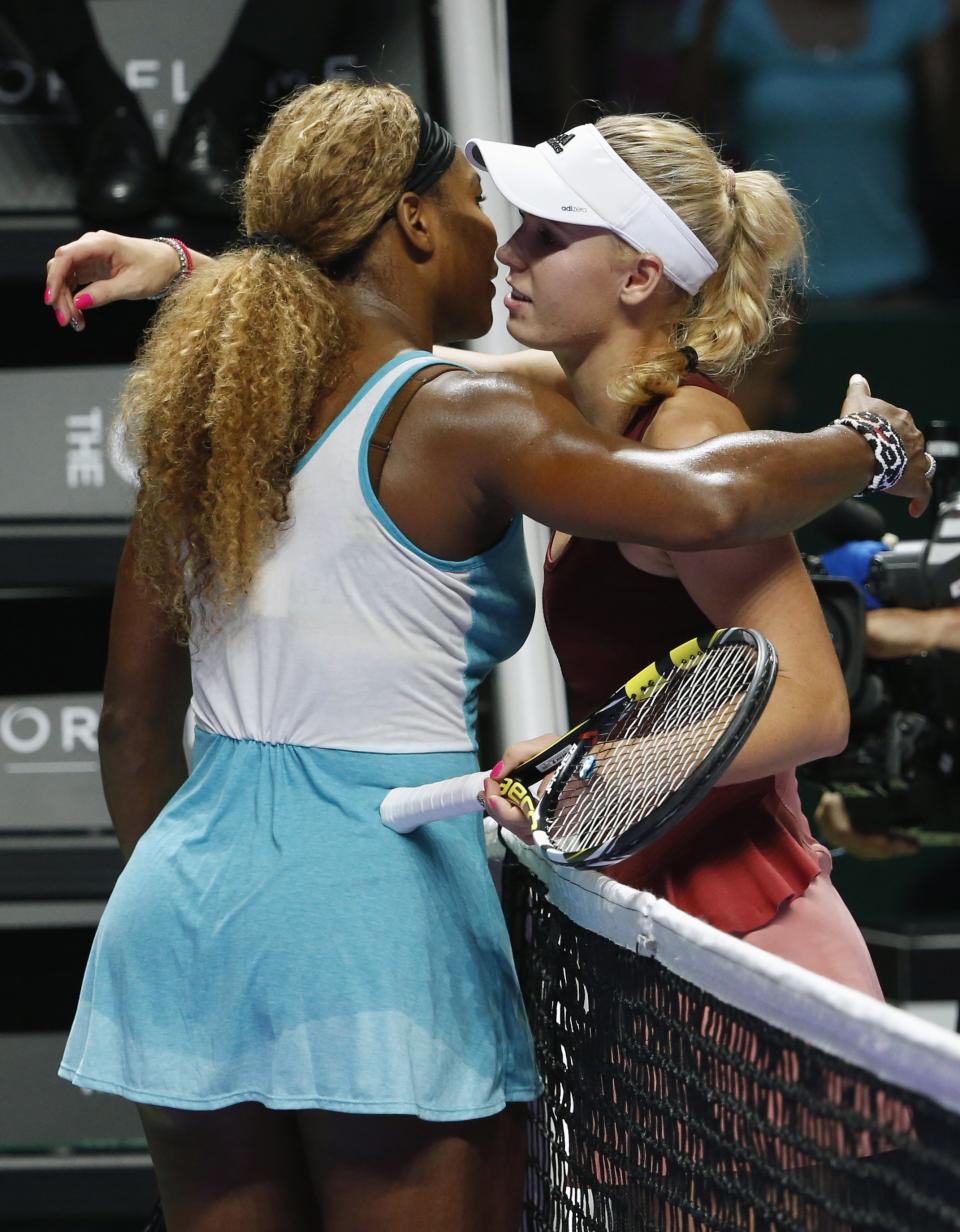 Serena Williams of the U.S. is congratulated by Caroline Wozniacki of Denmark after their WTA Finals singles semi-final tennis match at the Singapore Indoor Stadium